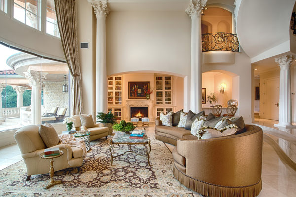 Cliff Point - Count & Castle Interior Design formal living room high ceilings fluted corinthian columns ottomans fireplace - web