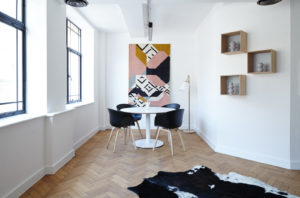 Small round table in white room